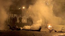 Tunisian police use tear gas to break up street protests