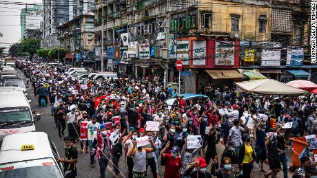 Protesters march through a street on February 8, 2021 in Yangon, Myanmar. 