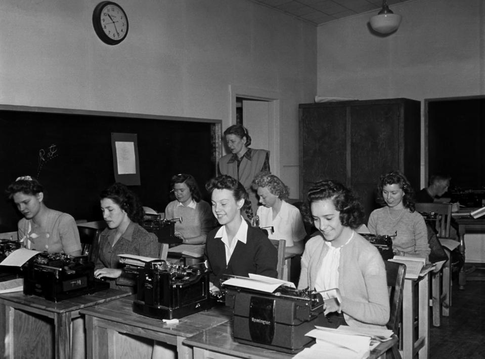 Young Women in Secretarial Pool Typing Documents