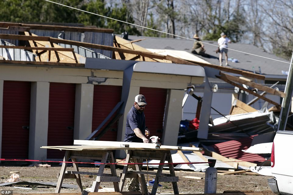Property owners survey damage and start work on repairs after dozens of homes and businesses were damaged by a tornado