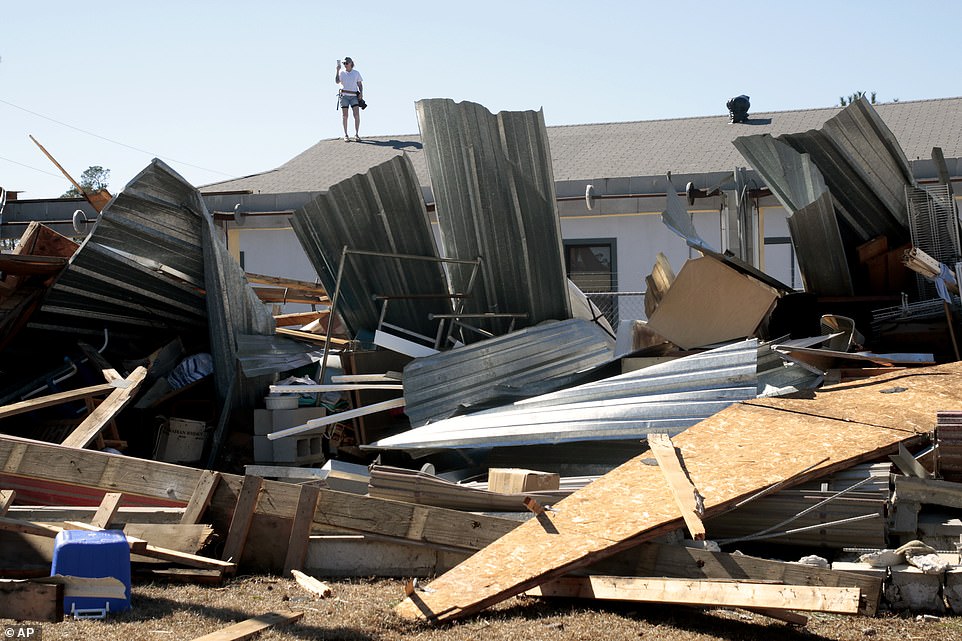 A property owner videos the damage to a home from severe weather in Brunswick County, N.C. near the town of Sunset Beach