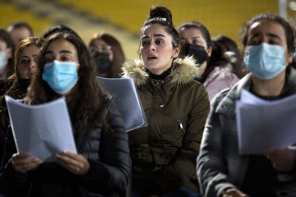 A joint Kurdish and Christian orchestra and choir rehearsing at a stadium in the Kurdish town of Erbil on Monday.