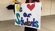 Cute signs and smiles greet students back from Spring Break