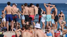Americans take spring break vacations despite experts’ concerns it will fuel virus spread
