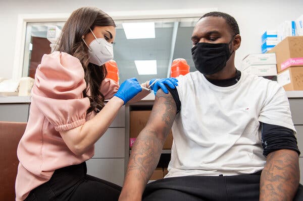 Vaccinations underway in Little Rock, Ark., on Monday. The rapid rollout of coronavirus vaccines is expected to help the United States economy to grow 6.5 percent this year.