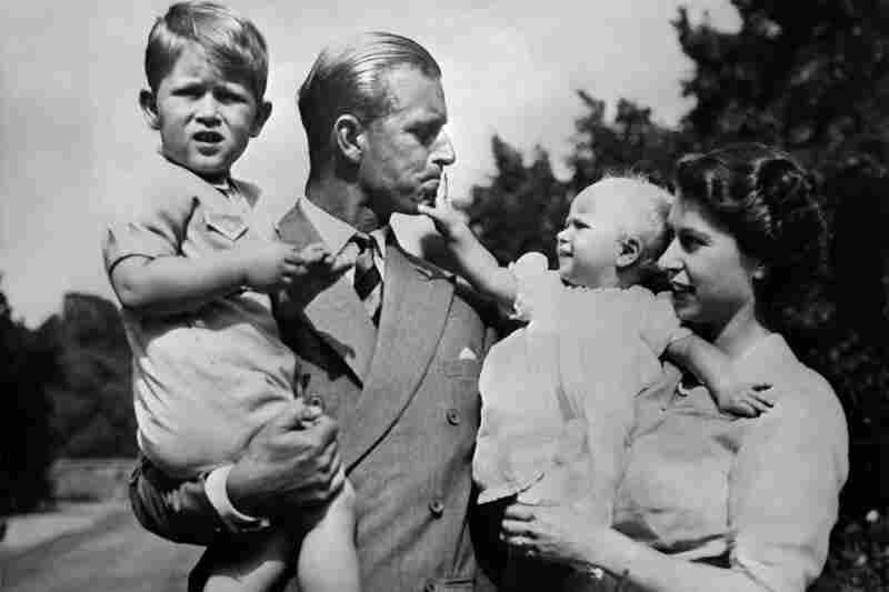 Philip and Elizabeth carry around their eldest children, Prince Charles and Princess Anne, circa 1951.