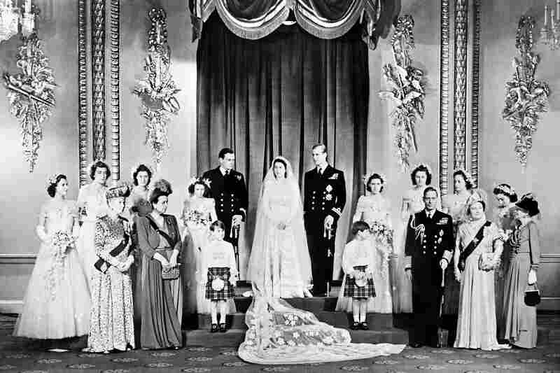 Members of the British royal family and guests pose around Princess Elizabeth and Philip, Duke of Edinburgh, in the Throne Room at Buckingham Palace on their wedding day, Nov. 20, 1947.