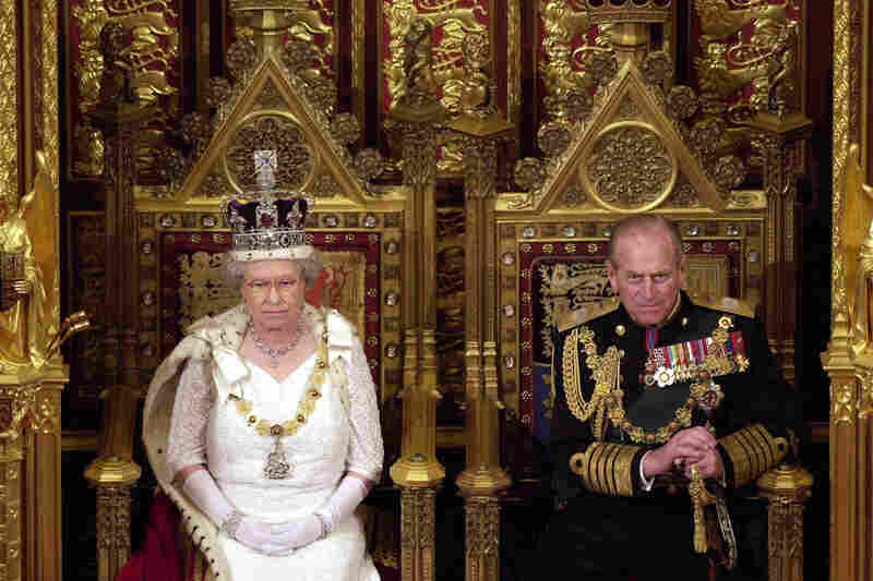 Queen Elizabeth II and Prince Philip attend the state opening of Parliament in London in 2000.
