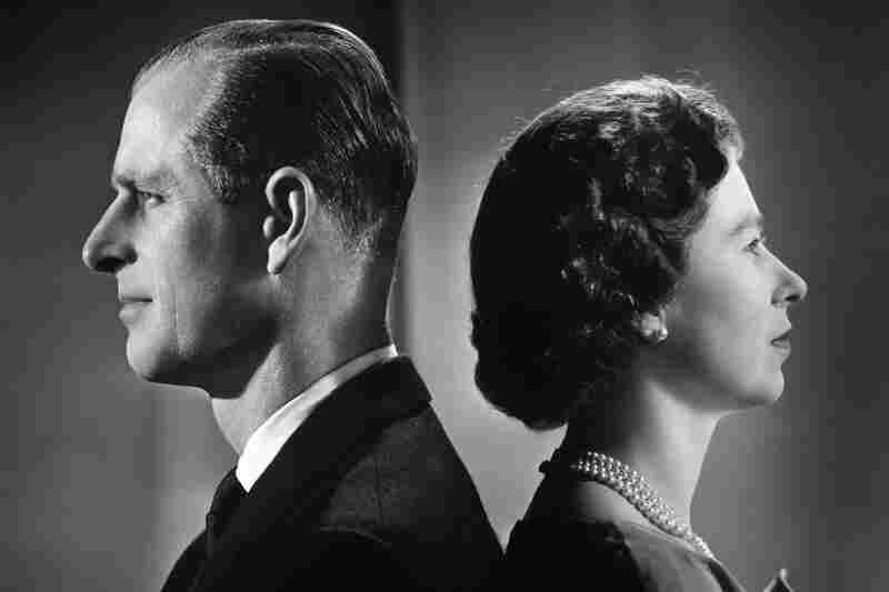 Queen Elizabeth II and Prince Philip, Duke of Edinburgh, pose for a portrait at home in Buckingham Palace in 1958.