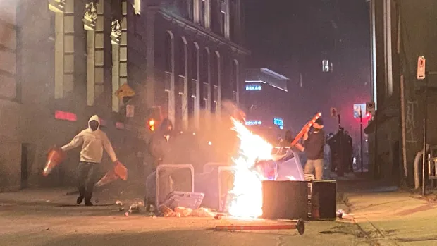 Protesters defy curfew in Old Montreal, setting fires, breaking windows