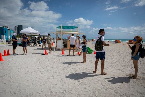 A pop-up vaccination site in Miami Beach, Fla. Companies are debating vaccine mandates for their workers.