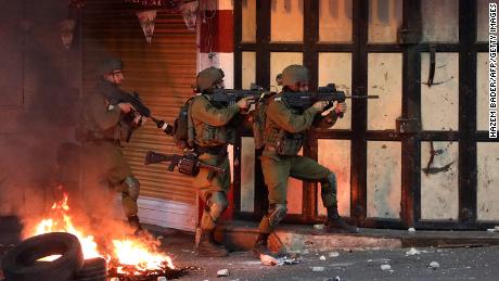 Israeli soldiers operate during clashes with Palestinian protesters in the city of Hebron, West Bank, on May 14.