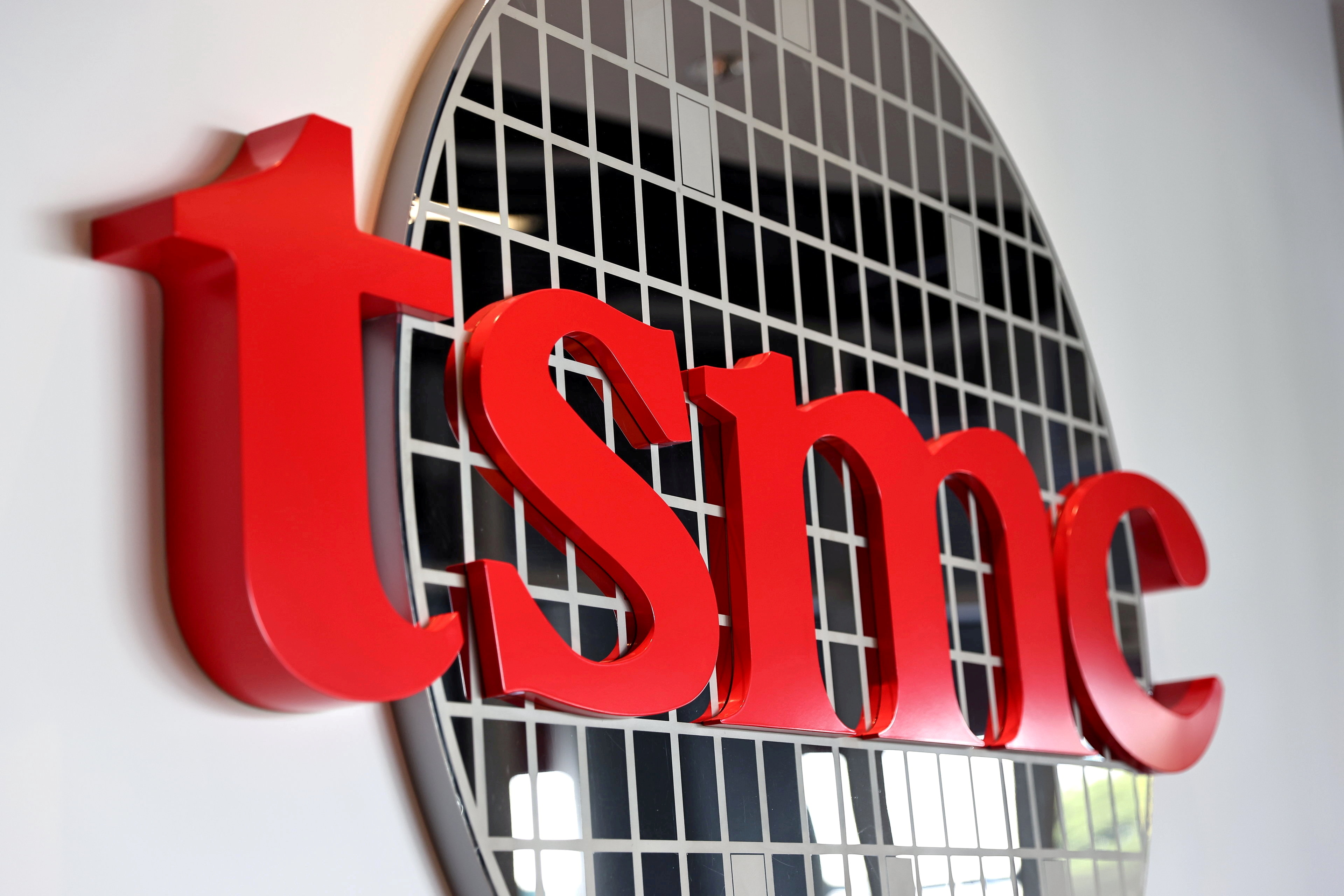 The logo of Taiwan Semiconductor Manufacturing Co (TSMC) is pictured at its headquarters, in Hsinchu, Taiwan, Jan. 19, 2021. REUTERS/Ann Wang