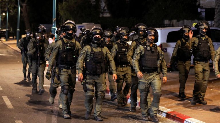 Israeli security force members patrol during a night-time curfew following violence in the Arab-Jewish town of Lod, Israel May 12, 2021