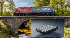 A composite image in which a photograph of an advanced battery is on top of a photo of a train crossing a bridge.