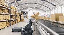 Automated Robot Carriers And Robotic Arm In Smart Distribution Warehouse