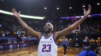 Boise State forward Naje Smith celebrates the team's victory over Wyoming in an NCAA college ba ...
