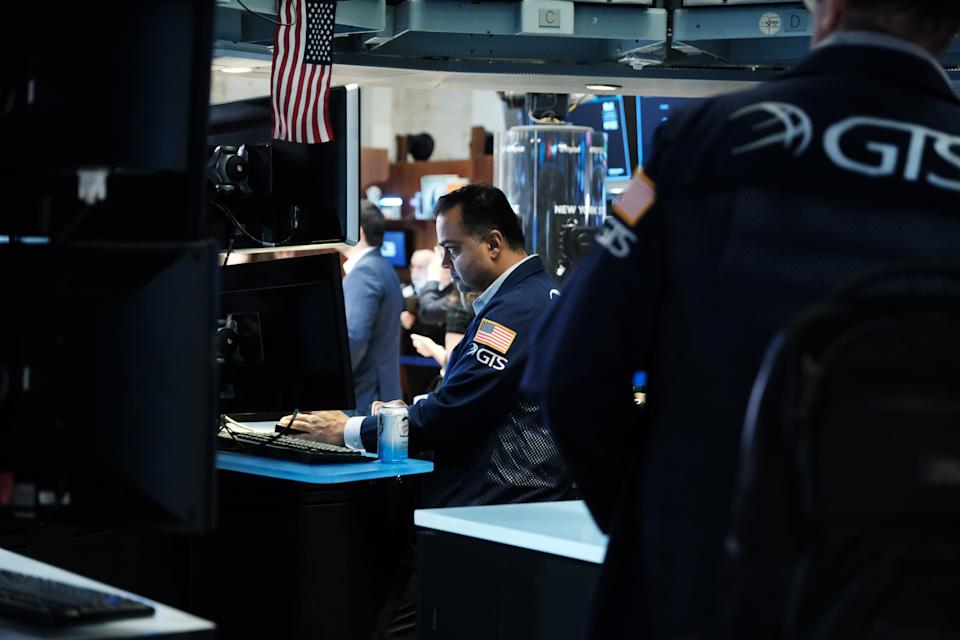 NEW YORK, NEW YORK - MARCH 11: Traders work on the floor of the New York Stock Exchange (NYSE) on March 11, 2022 in New York City. The Dow Jones Industrial Average was up over 200 points in morning trading on the last day of a volatile week for global markets.  (Photo by Spencer Platt/Getty Images)