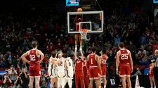 Indiana basketball cheerleaders retrieve ball in March Madness action
