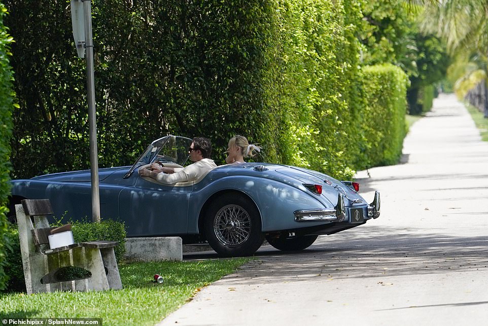 Opulent: The motor appears to be a vintage Jaguar Roadsters