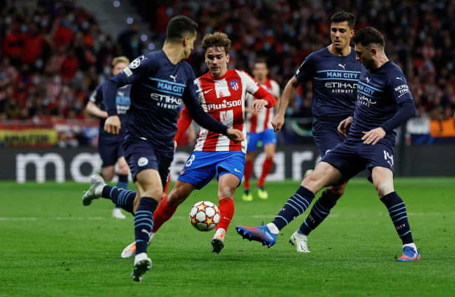 Atletico Madrid’s Antoine Griezmann in action with Manchester City’s Aymeric Laporte.