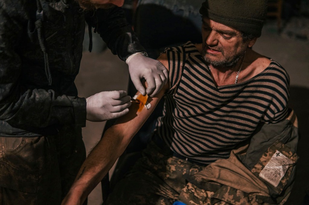 A member of the Azov Regiment getting treatment for an injury in the Azovstal plant on May 10, 2022.