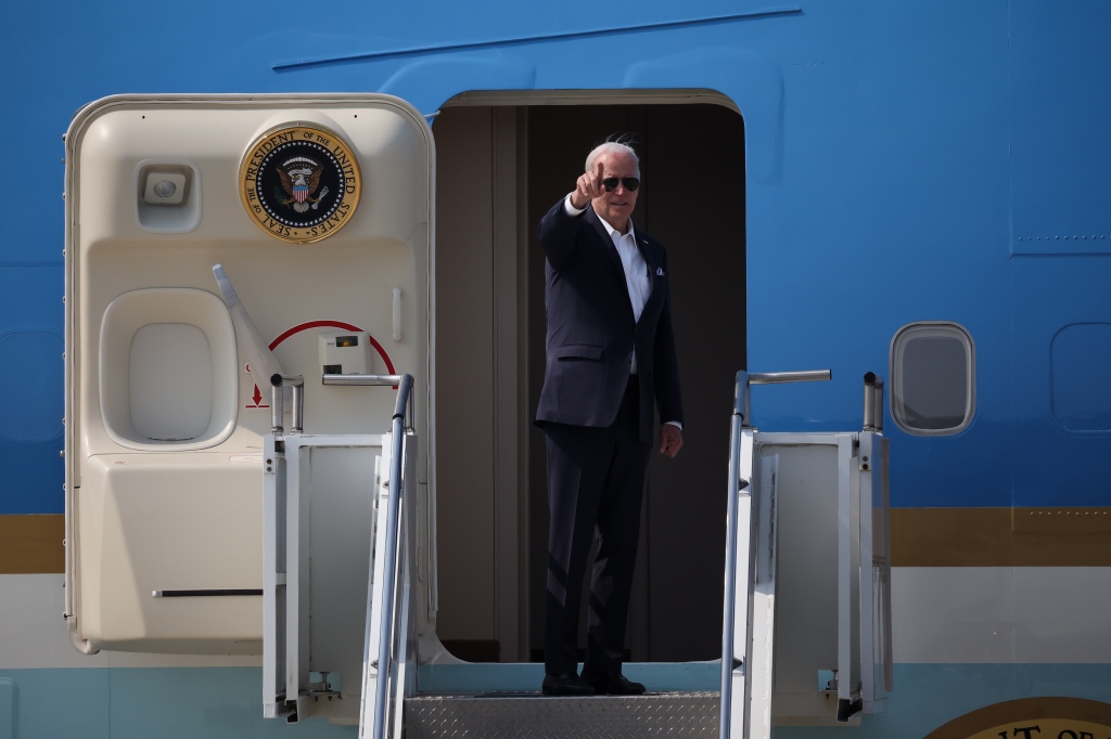 President Joe Biden gestures as he boards Air Force One departing for Japan at Osan Air Base in Pyeongtaek, South Korea on May 22, 2022.