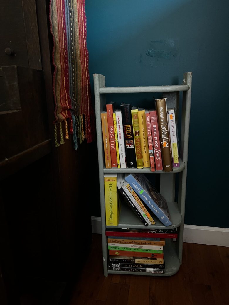 a picture of a bookshelf with cookbooks