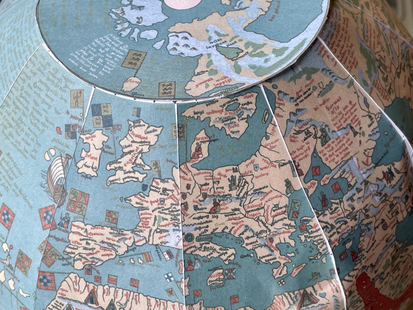Photograph of the paper globe, showing Europe and part of the north pole.