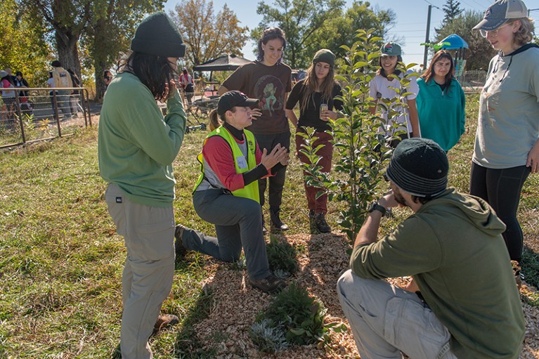 Amy Dunbar-Wallis with Boulder Apple Tree Project students at the outdoor orchard Apple Blitz 2023 outreach event.
