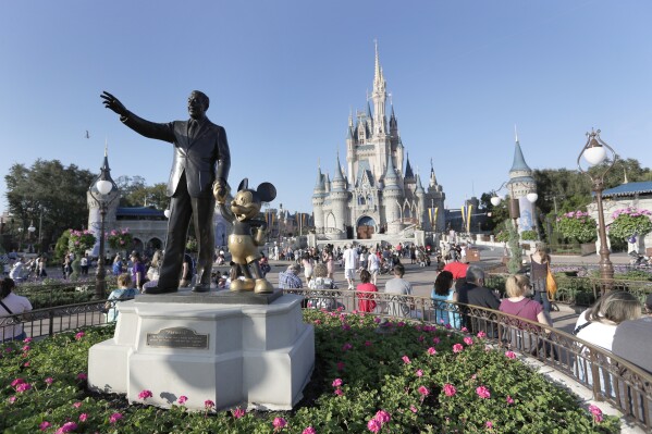 FILE - A statue of Walt Disney and Mickey Mouse appears in front of the Cinderella Castle at the Magic Kingdom theme park at Walt Disney World, Jan. 15, 2020, in Lake Buena Vista, Fla. The earliest version of Disney's most famous character, Mickey Mouse, and arguably the most iconic character in American pop culture, will become public domain on Jan. 1, 2024. (AP Photo/John Raoux, File)